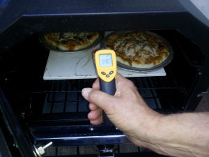 Pizza stone to temp. By the way, if you don't have one of the handy infrared thermometer guns, you can find one cheap on eBay. They are as essential as a good spoon. 